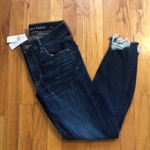 Brand new! dark wash with rips at the bottom